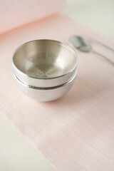 Korean traditional silverwares on pink ramie cloth.