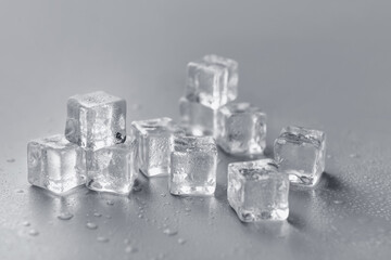 Ice cubes on grey background