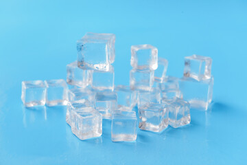 Ice cubes on color background