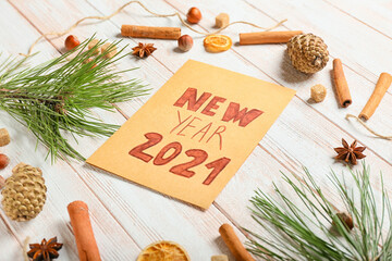 New Year greeting card and decor on wooden background