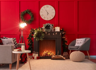 Decorated fireplace in interior of room on Christmas eve
