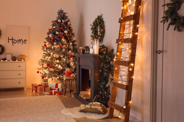 Decorated fireplace in interior of room on Christmas eve