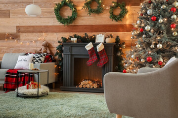 Decorated fireplace in interior of room on Christmas eve