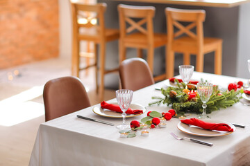 Beautiful table setting with Christmas decor in living room