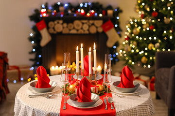 Beautiful table setting with Christmas decor in living room
