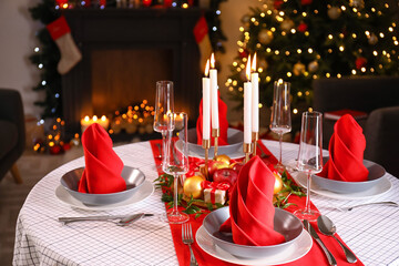 Beautiful table setting with Christmas decor in living room
