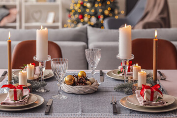 Beautiful table setting with Christmas decor in living room