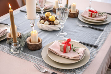 Beautiful table setting with Christmas decor in living room