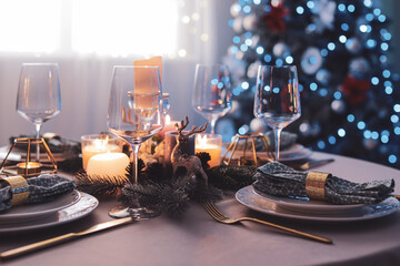 Beautiful table setting with Christmas decor in living room