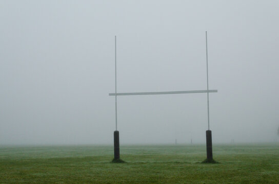 rugby posts and mist on a New Zealand rugby field in winter