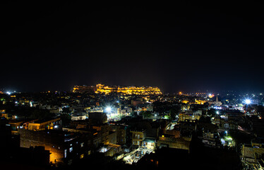  a beautiful view of a jaisalmer city and jaisalmer fort at night

