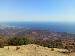 Amazing view on sea and mountains in the distance in hot summer. Vacation, summer travel. Black sea, seacoast. Crimea. 