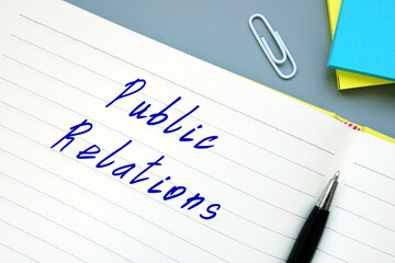 Business concept about Public Relations with inscription on the piece of paper.
