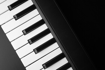piano keys close up on dark background