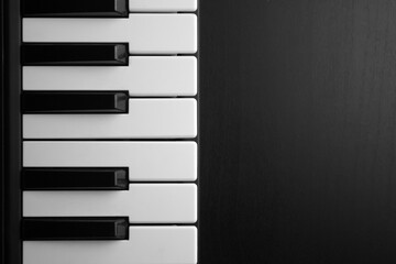 piano keys on black background dark light