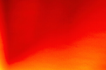 Abstract red background with gradient transitions and shadows.