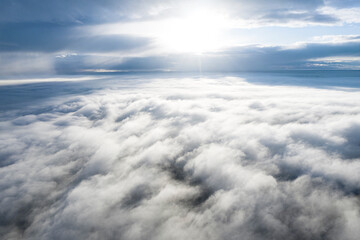 Obraz na płótnie Canvas Aerial view white clouds in blue sky. View from drone. Aerial view cloudscape texture background. Texture of clouds. View from above. Panorama clouds background