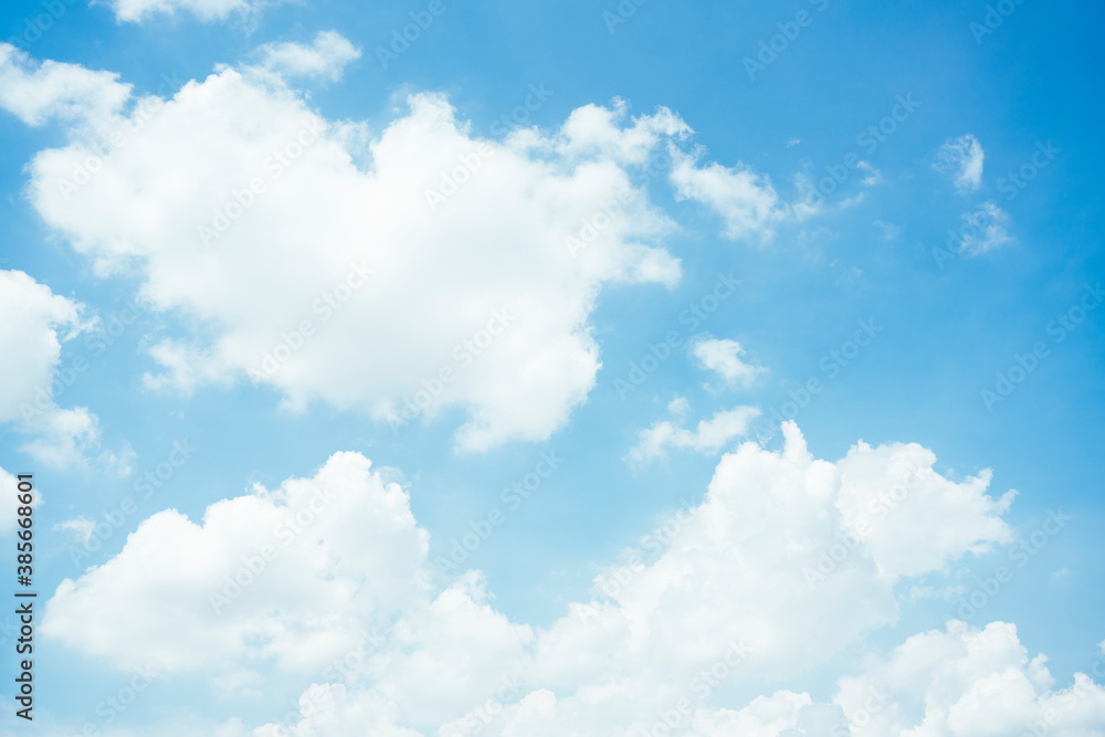 Wall mural cloudscape with fluffy white cloud in blue sky.