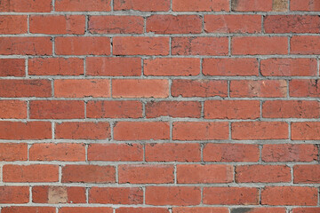 An old and weathered red brick wall