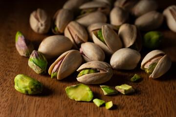 Pistachios on a wooden background