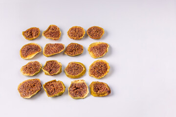 slices of dried figs on a white background. dried fruits. eco. top view.