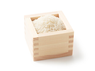 Rice in a measuring cup on a white background