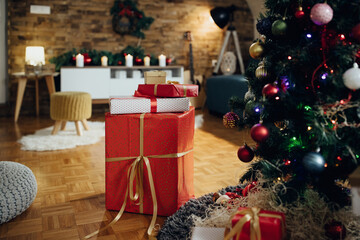 Wrapped presents under the Christmas tree at home.