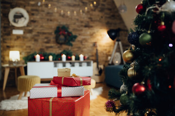 Wrapped gifts under the Christmas tree in the living room.