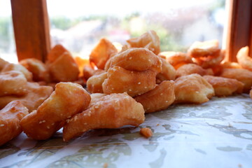 Odading is a fried cake with sesame seeds on the outside. This food is from West Java, Indonesia.