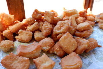 Odading is a fried cake with sesame seeds on the outside. This food is from West Java, Indonesia.