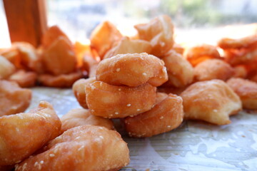 Odading is a fried cake with sesame seeds on the outside. This food is from West Java, Indonesia.