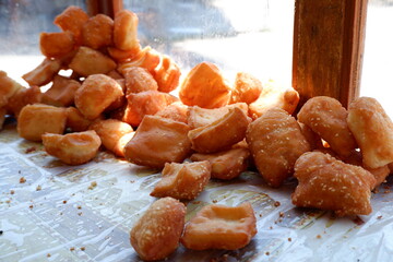 Odading is a fried cake with sesame seeds on the outside. This food is from West Java, Indonesia.