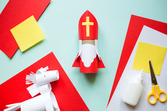 paper craft for kids. DIY toy Saint Nicholas and white horse for sinterklaas day. create art for children. Netherlands Santa Claus.