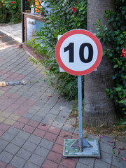 Road sign speed limit 10 on a pedestrian road. Speed limit in the pedestrian zone