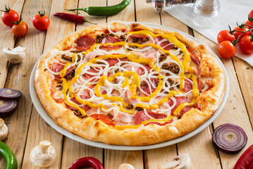 tasty pizza on the wooden background