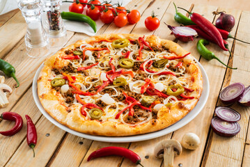 tasty pizza on the wooden background