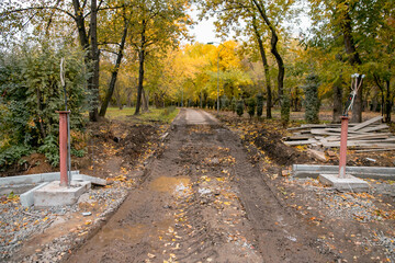 The process of reconstruction of the city park, work on the walking path