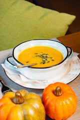 pumpkin cream soup on the table
