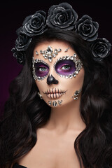 Portrait of a woman with sugar skull makeup over red background. Halloween costume and make-up. Portrait of Calavera Catrina