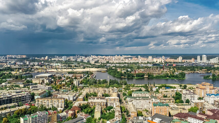 Fototapeta na wymiar Aerial top view of Kyiv cityscape, Dnieper river and Podol historical district skyline from above, city of Kiev, Ukraine 