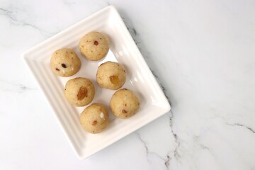  Rawa Ladu, Rava coconut Laddu or Semolina balls. It's a sweet dish from Maharashtra, India. Made using semolina, coconut & sugar. Its famous for festivals like, Diwali, Dussehra, Navratri. copy space