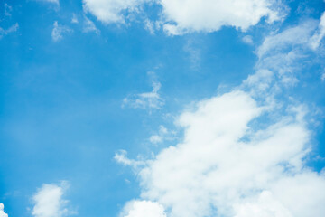 Naklejka na ściany i meble Cloudscape with fluffy white cloud in blue sky.