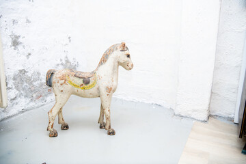 wooden toy horse on a gray background