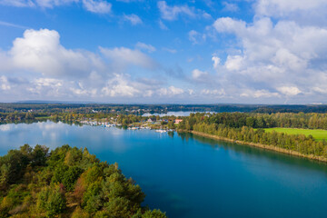 Fototapeta na wymiar Lake landscape with sailing boats in the Bavarian Forest in the Upper Palatinate from a bird's eye view - drone image