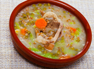 Scottish cuisine. Thick soup with mutton meat, green peas, cabbage and barley