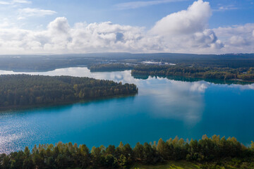 Drones panorama in the autumn lake landscape of the Upper Palatinate with turquoise blue water and sun reflections