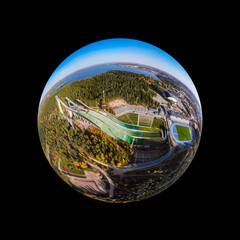 A three dimensional aerial panoramic view of Lahti sports centre with three ski jump towers, in a...