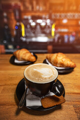 Cup of coffee and croissant