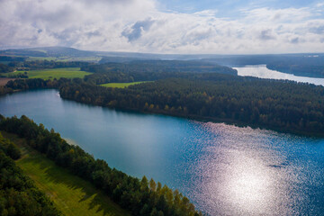 Drones panorama in the autumn lake landscape of the Upper Palatinate with turquoise blue water and...