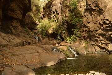 Surfing and cliff diving by the waterfalls in El Salvador, Central America